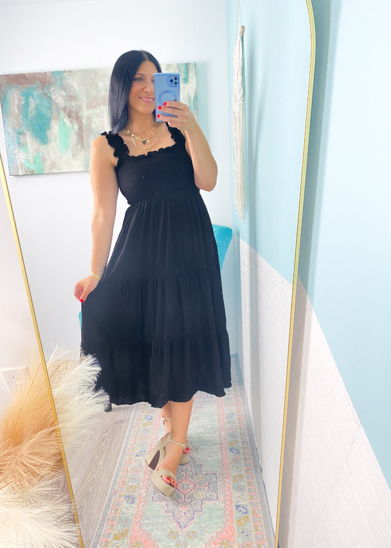 'Moonlight Shadow' Black Smocked Tiered Midi Dress-A classic black midi dress with a smocked top + ruffle straps. The lightweight fabric makes it perfect to throw on and go on hot Summer days but it can also be dressed up for semi casual events!-Cali Moon Boutique, Plainville Connecticut