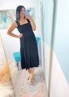 'Moonlight Shadow' Black Smocked Tiered Midi Dress-A classic black midi dress with a smocked top + ruffle straps. The lightweight fabric makes it perfect to throw on and go on hot Summer days but it can also be dressed up for semi casual events!-Cali Moon Boutique, Plainville Connecticut